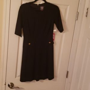 Black dress with gold buttons